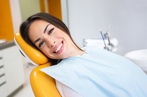Woman smiling while relaxing in treatment chair