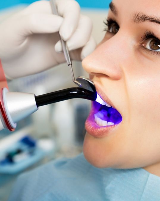 Woman receiving direct bonding from cosmetic dentist