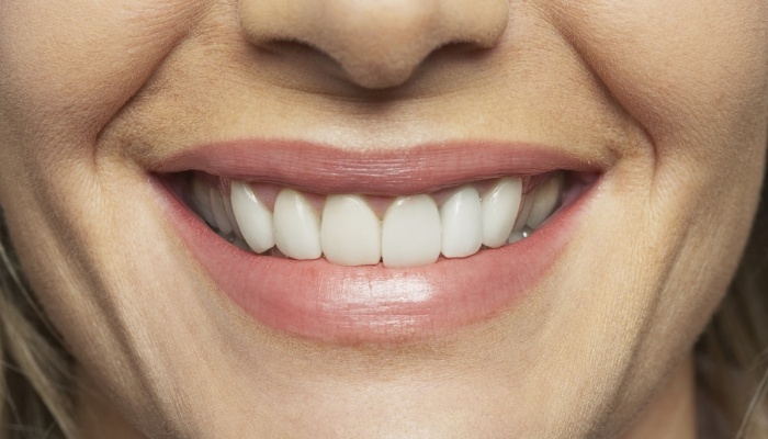 Close up of a smile with straight white teeth