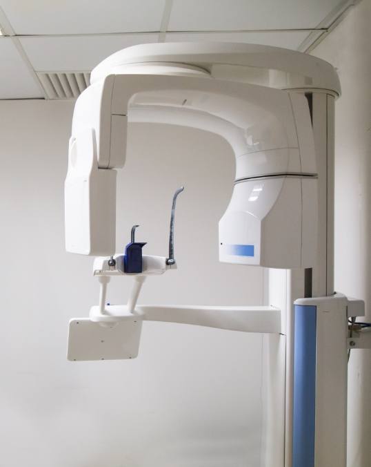 C B C T dental scanner in white hallway