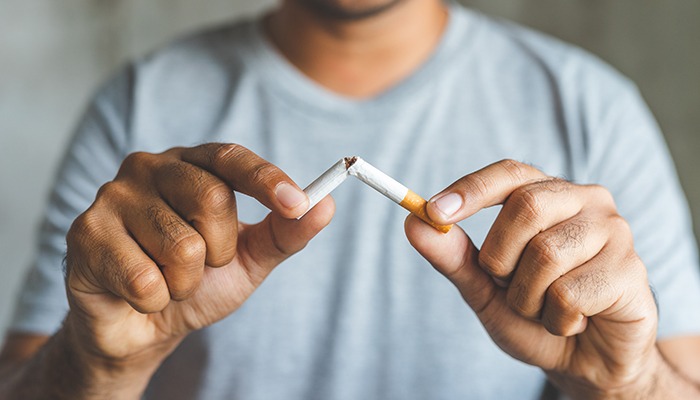 Man breaks cigarette