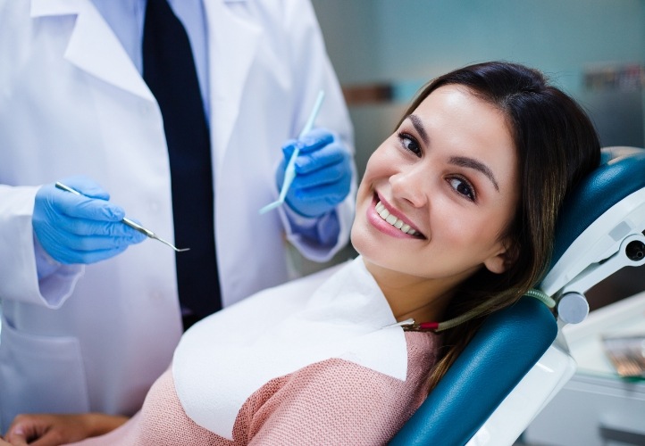 Young woman smiling in dental chair in Saint Peters dental office