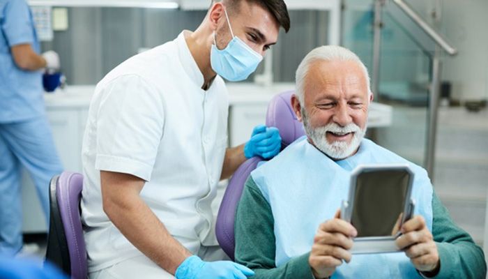 a patient receiving their restorations in Saint Peters