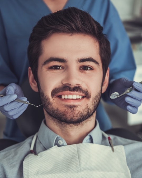 Man with beard in dental chair during dental checkup