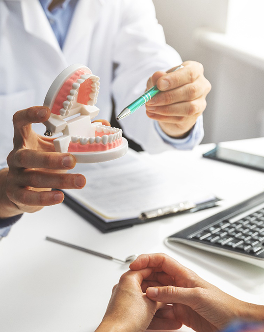 woman talking with dentist about root canal treatment 