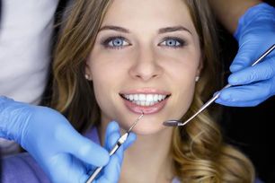 smiling woman in dental chair