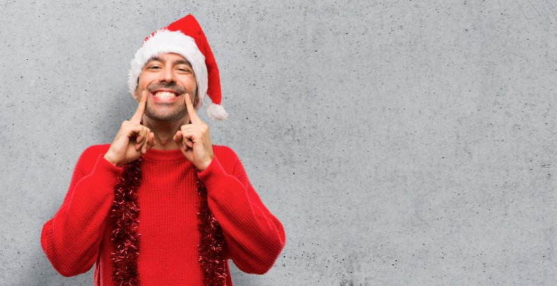 man dressed for holidays smiling